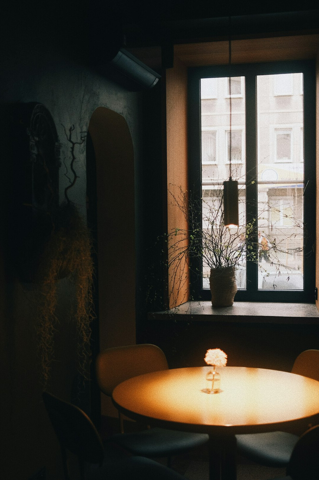 Cozy cafe table with coffee and a notebook by a window